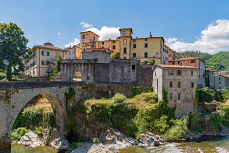 Old town of Castelnuovo di Garfagnana at the Tuscany Region in Italy with the old bridge over the Riverの写真素材