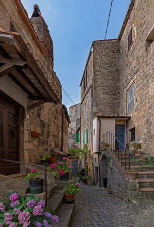 Narrow street at the old town of Sorano at the Tuscany Region in Italyの写真素材