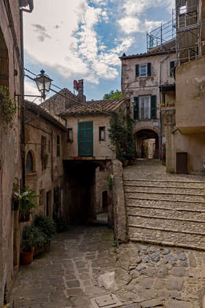 Narrow street at the old town of Sorano at the Tuscany Region in Italyの写真素材