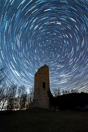 Startrails over Ebersburg Castle at Poppenhausen in Hesse, Germanyの写真素材