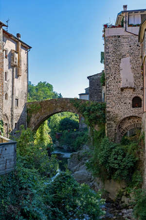 Bridge over a river at the town of Bagnone at the Tuscany Region in Italyの写真素材