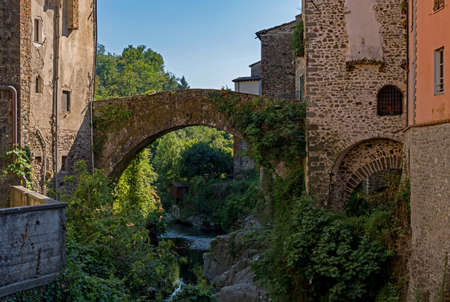 Bridge over a river at the town of Bagnone at the Tuscany Region in Italyの写真素材