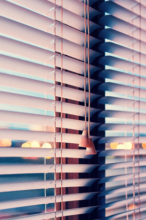 Blinds on the window lit sunsets sunshineの写真素材