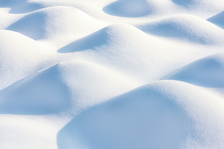 Fresh snow cover in dunes at closeup, a winter landscapeの写真素材