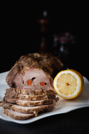 A piece of fried meat with lemon. Rustik lightの写真素材