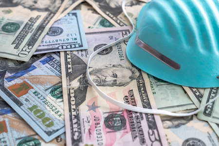 Medical expense background image with a blue respiratory hospital doctor mask or face covering with...