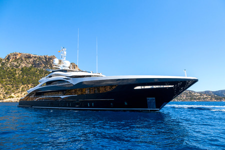 Dark blue luxury yacht sailing