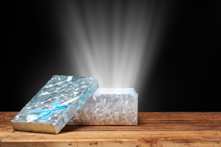Blue gift box with magic lightの写真素材