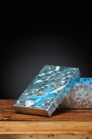 Blue gift box on black backgroundの写真素材