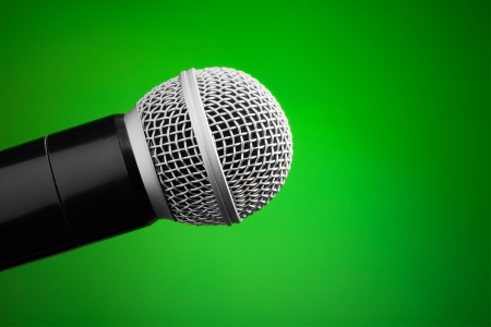 Professional microphone on green backgroundの写真素材