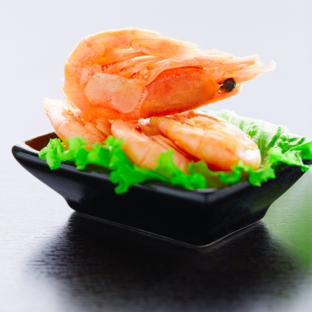 Shrimps and salad on a plateの写真素材