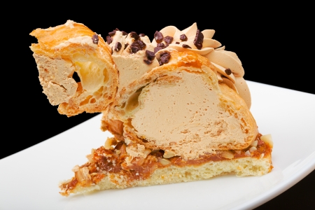 Pie slice on plate isolated on black