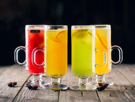Fresh summer colorful f fruit cocktails on wooden backgroundの写真素材