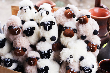 Plush toy rams in a box on the market.の写真素材