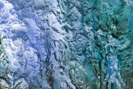 Interesting blue texture of blown paint on the wallの写真素材