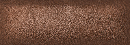 Brown leather texture closeup. Useful as background for design-works.