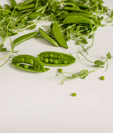 Green peas are a veritable storehouse of protein, fiber, and sugar. The most valuable dietary product is considered to be juicy pods peas.の写真素材