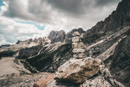 Italian alps view behind some rocks