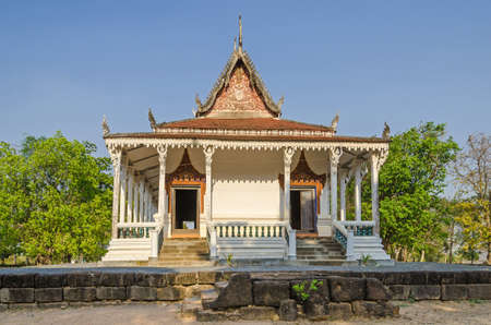 The oldest monastery building (Vihara) near the village Kampong Tralach Leu with its typical Khmer roof, decorated with bas-reliefs and column figurine (Kinnara) as a supporting pillarの写真素材