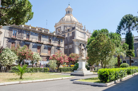 The square of Catania Cathedral, dedicated to Saint Agatha, with its typical Sicilian Baroque style, decorated with marble statue.の写真素材