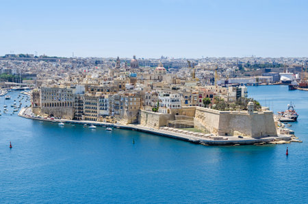 Senglea peninsula as seen from the Upper Barrakka Gardens with its waterfront, the St.Philip's Chapel dome, bastions of Fort Saint Michael and buildings inside of defensive wallsのeditorial素材