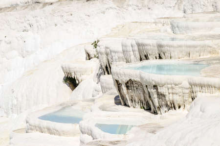 Pamukkale's terraces, made of travertine, a sedimentary rock deposited by water from the hot springs.の写真素材