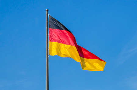 German flag waggled on the top of Reichstag in Berlinの写真素材