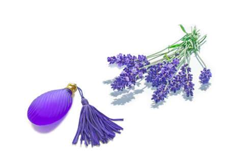 A bunch of lavender and a small fragrance flacon isolatedの写真素材