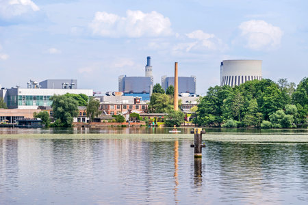 Berlin, Germany - June 28, 2021: View from Frieda-Arnheim-Promenade over the River Havel at the banks of the district Haselhorst with the Reuter West cogeneration plant operated by Vattenfall Europe Waermeのeditorial素材