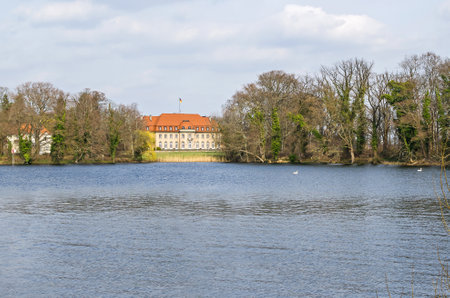 Berlin, Germany - March 20, 2019: Nature conservation area Tegel Forest at the Lake Tegel with the Borsig Villa Reiherwerder, the Federal Foreign Minister's guest house in the Baroque Revival, also known as Neo-Baroque styleのeditorial素材