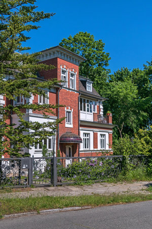 Berlin, Germany - June 3, 2021: One of the few preserved villas in the settlement Schlachtensee, district, developed as a villa colony, at the street Marinesteig 28, now the seat of IMW Asset Management Ltd.のeditorial素材
