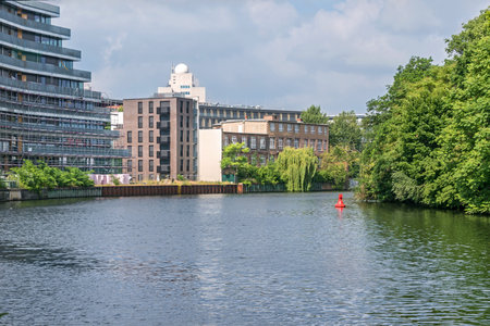 Berlin, Germany - July 3, 2021: Bank of the river Spree Schleswiger Ufer with recently erected buildings and the tower of the Fraunhofer Institute for Telecommunicationsのeditorial素材