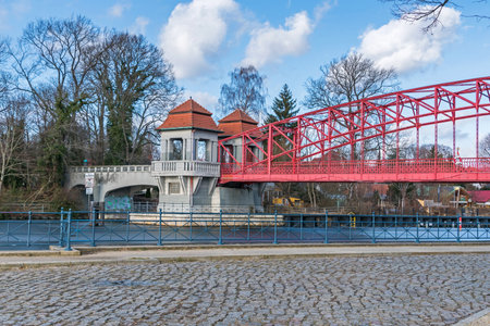 Berlin, Germany - February 19, 2021: Heritage-protected steel truss Haven bridge (Sechserbruecke) over the stream Tegeler Fliess with its pavilion-like gate and two ticket boothsのeditorial素材