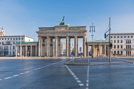 Berlin, Germany - December 18, 2020: Platz des 18. Maerz (18 of March Square) with the Brandenburg Gate, Hanukkah candlestick, decorated Christmas tree and television tower in the backgroundのeditorial素材