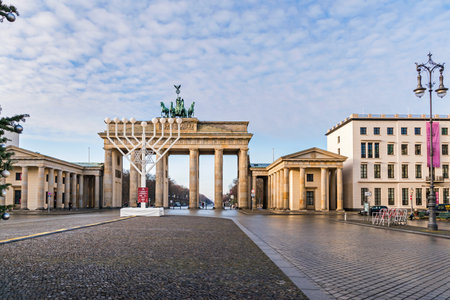 Berlin, Germany - December 18, 2020: Historic square Pariser Platz with the Brandenburg Gate, largest Hanukkah candlestick in Europe for the Jewish festival of lightsのeditorial素材