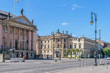 Unter der Linden boulevard and the Bebelplatz (colloquially the Opernplatz) with the State Opera building and the former Royal Library, now seat of the Humboldt University law facultyのeditorial素材