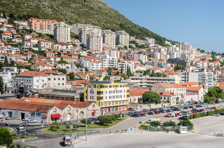 Dubrovnik, Croatia - June 9, 2017: Modern part of Dubrovnik, rebuild and renewed after the war and the break-up of Yugoslavia, part of the street Obala Stjepana Radica at the seaport with a church and apartment hotelsのeditorial素材