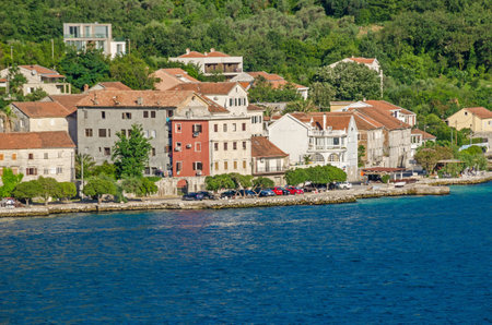Kotor, Montenegro - June 8, 2017: Prcanj - a small town along the Bay of Kotor, Montenegro. A part of the waterfront, that consists of a long line of stone villas.のeditorial素材