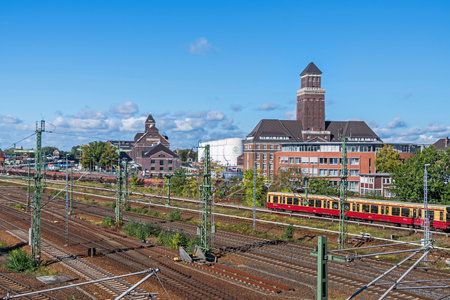 Berlin, Germany - October 6, 2021: Railroad station, administration building and S-train in the Westhafen harbor BEHALA, one of Germany's largest inland ports located right in the heart of Berlinのeditorial素材