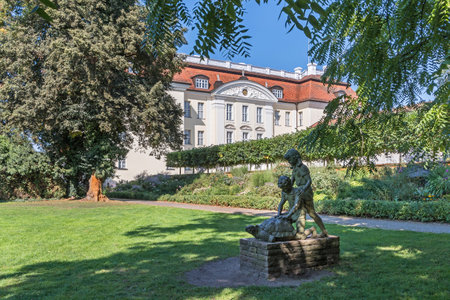 Berlin, Germany - September 6, 2021: Baroque water castle Koepenick Palace, today museum of arts, with its English-style park and garden sculptureのeditorial素材