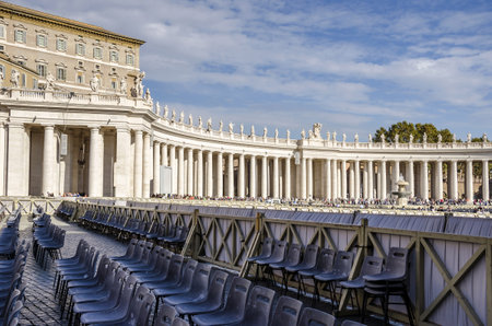 Vatican City, Vatican City State - November 5, 2015: Tuscan colonnades of St.Peter's Square with a lot of seats prepared for catholic believers in anticipation of His Holiness Pope Francisのeditorial素材