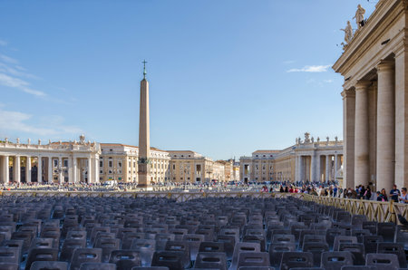 Vatican City, Vatican City State - November 5, 2015: Tuscan colonnades of St.Peter's Square with a lot of seats prepared for catholic believers in anticipation of His Holiness Pope Francisのeditorial素材