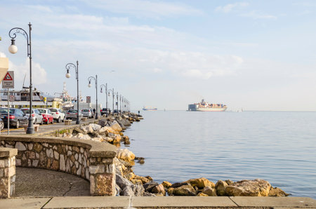 La Spezia, Italy - November 4, 2015: A view of Gulf of La Spezia with a pier and several commercial ships from the water front Morin in La Spezia, the chief Italian naval station and arsenal.のeditorial素材