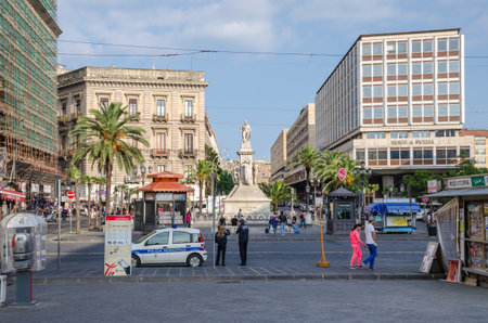 Catania, Italy - November 7, 2015: Stesichorus Square and Bellini's Monument at the end of a workday.のeditorial素材