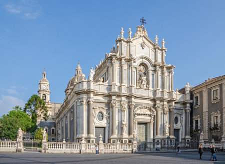 Catania, Italy - November 7, 2015: Catania Cathedral with its typical Sicilian Baroque faÃ§ade designed by Giovanni Battista Vaccarini, decorated with marble statues. The Baroque city center of Catania is a UNESCO World Heritage Site.のeditorial素材