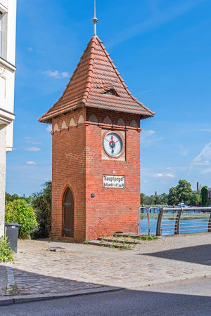 Brandenburg an der Havel, Germany - June 14, 2022: Red bricks tower-shaped Main water level gauge at the Street Muehlendamm built in 1904 in the headwaters of the Havelのeditorial素材