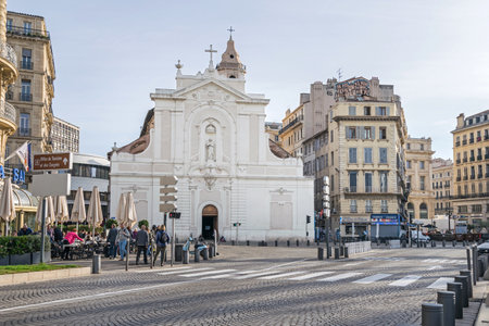 Marseille, France - November 1, 2019: Quai des Belges with street coffee houses and a Gothic facade of the Roman Catholic church Eglise Saint-Ferreol les Augustinsのeditorial素材