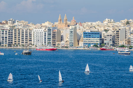 Gzira, Malta - November 8, 2015: View of Gzira, a town located in  Marsamxett Harbour, as seen from Valletta. Waterfront and densely built-over modern buildings.のeditorial素材