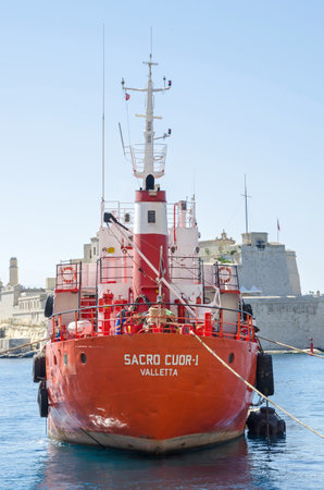 Senglea, Malta - June 4, 2017: Oil Products Tanker Sacro Cuor 1 anchored in the Grand Harbour of Valletta with Senglea waterfront and Fort Saint Michael in a backgroundのeditorial素材
