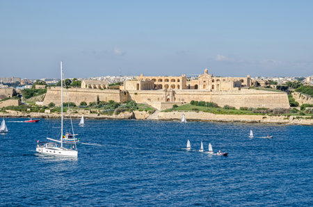 Valletta, Malta - November 8, 2015: View of Fort Manoel - an example of Baroque architecture, - on Manoel Island in Gzira from the sea. Fort Manoel is located to the north west of Valletta, and commands Marsamxett Harbour and the anchorage of Sliema Creekのeditorial素材